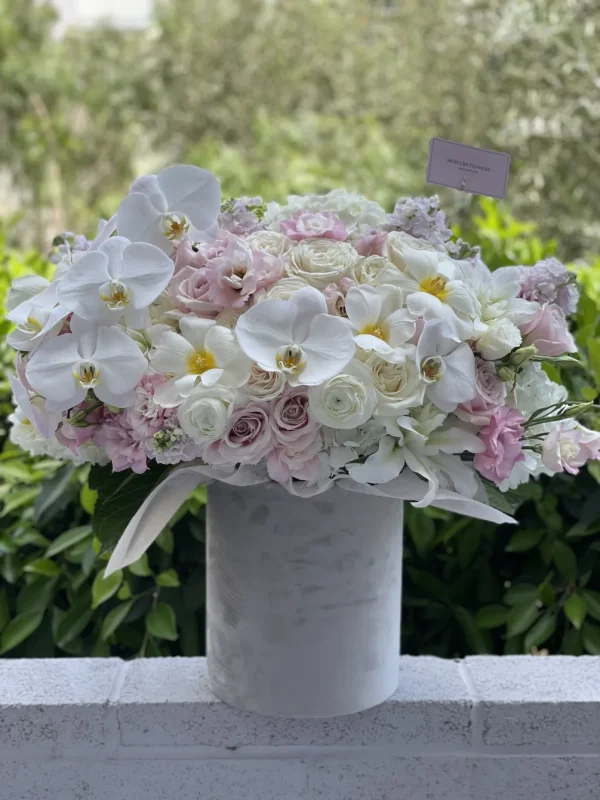 Grey velvet box with white orchids